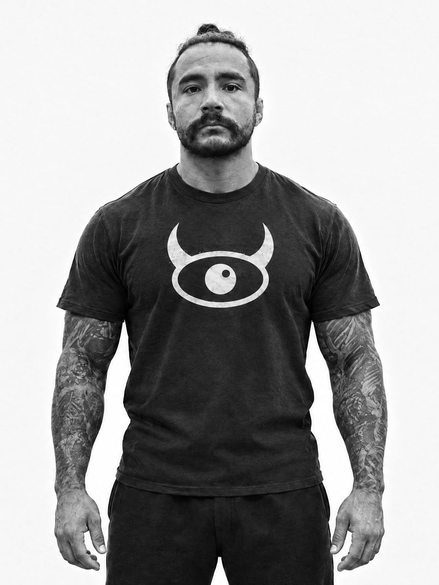 Tattooed model in the black tee, horns forward